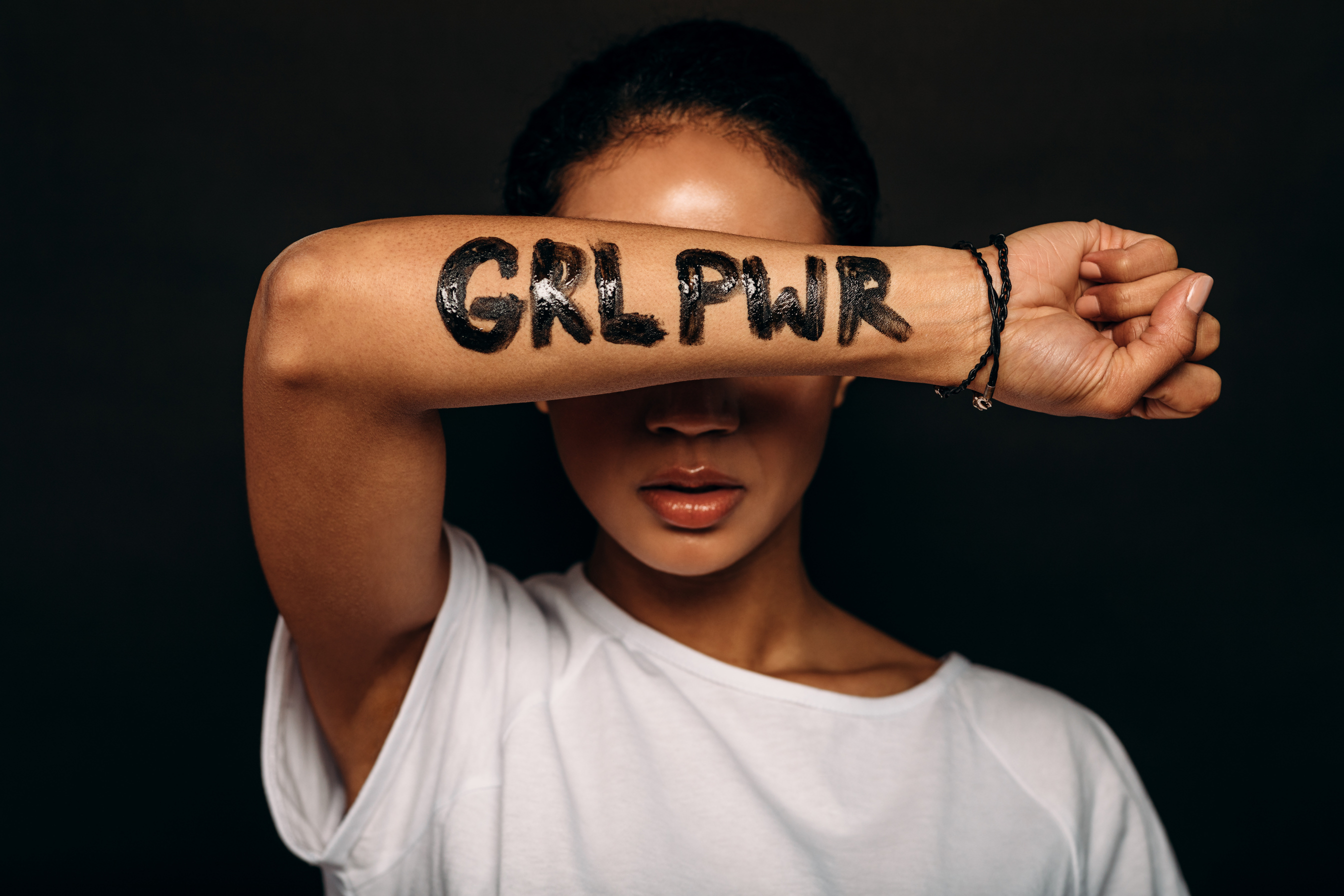 Woman with Girl Power Written on Arm